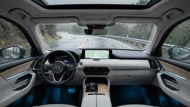 2026 CX-5 interior and infotainment screen compared with the previous-generation cabin.